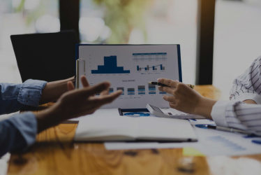 Employees analyzing financial information