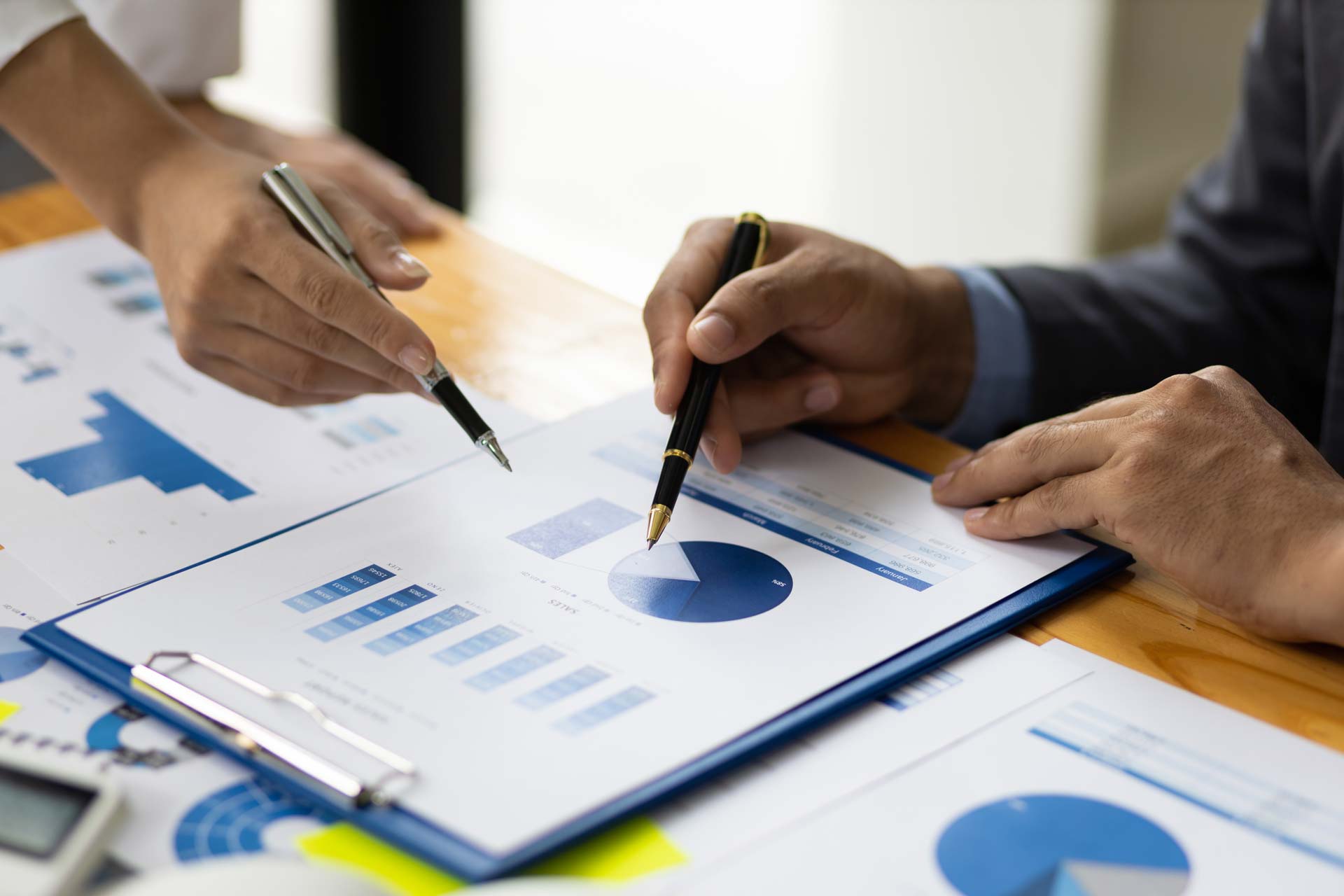 Employees analyzing data on papers