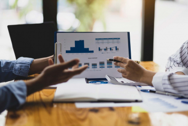 Employees analyzing financial information