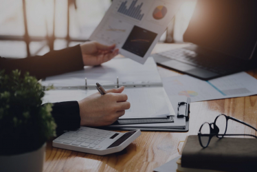 Employees analyzing financial charts